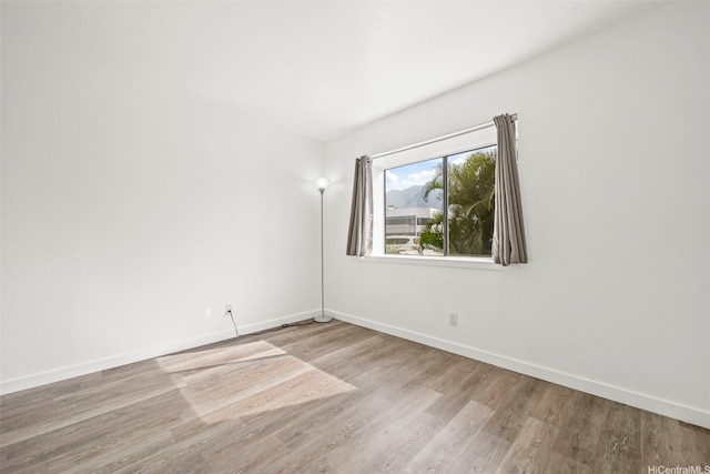 46-010 Aliikane Pl Unit 211, Kaneohe, HI 96744 - spare room featuring baseboards and wood finished floors