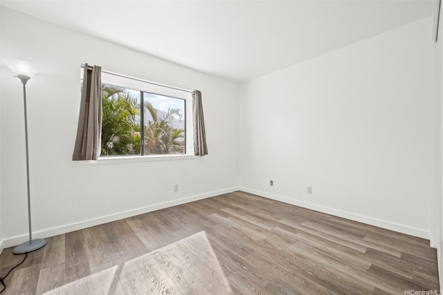 46-010 Aliikane Pl Unit 211, Kaneohe, HI 96744 - spare room with wood finished floors and baseboards