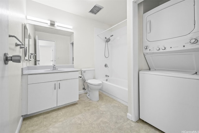 46-010 Aliikane Pl Unit 211, Kaneohe, HI 96744 - full bath with stacked washer / drying machine, toilet, vanity, baseboards, and bathtub / shower combination