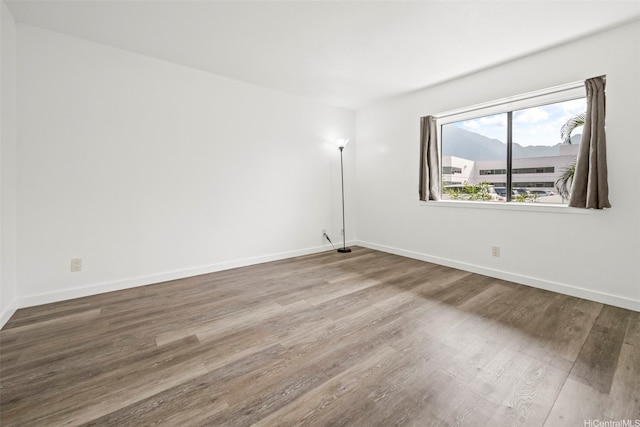 46-010 Aliikane Pl Unit 211, Kaneohe, HI 96744 - spare room featuring wood finished floors and baseboards