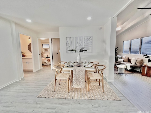 dining room with light wood-style flooring and baseboards
