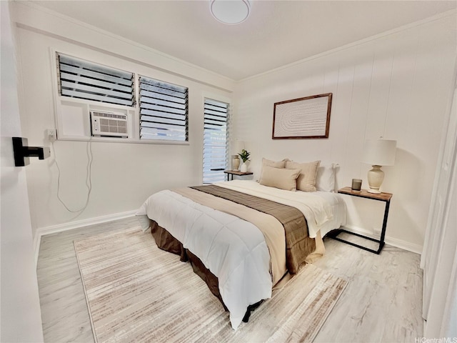 bedroom featuring wood finished floors, crown molding, cooling unit, and baseboards