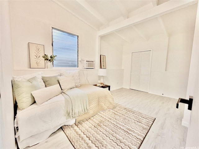 bedroom featuring wood finished floors and a closet