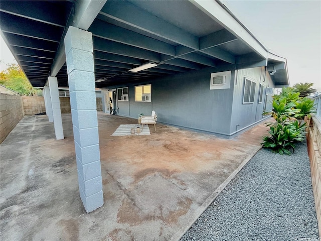 view of patio / terrace with a fenced backyard and an attached carport