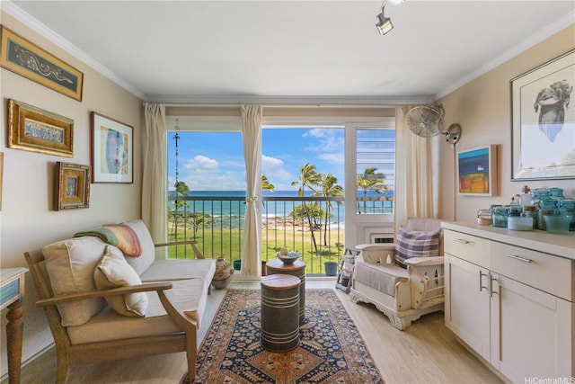 85-175 Farrington Hwy Unit B416, Waianae, HI 96792 - living area featuring a water view, crown molding, light wood finished floors, and plenty of natural light