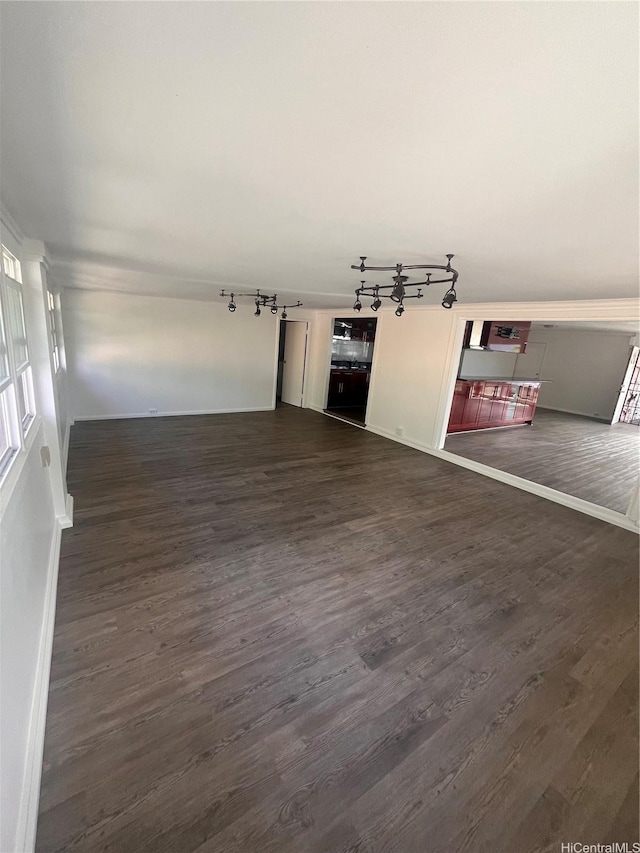 45-342 Lehuuila St, Kaneohe, HI 96744 - unfurnished living room with dark wood-type flooring and baseboards