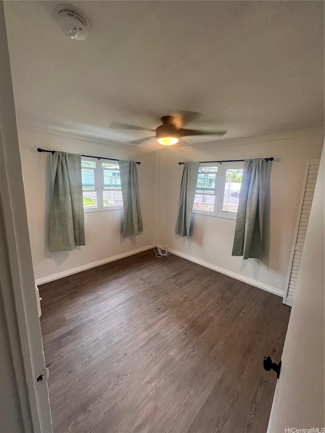 45-342 Lehuuila St, Kaneohe, HI 96744 - spare room featuring a ceiling fan, plenty of natural light, dark wood-style flooring, and baseboards