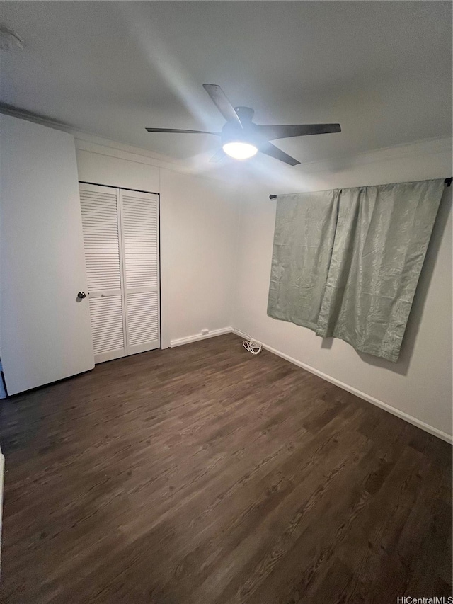 45-342 Lehuuila St, Kaneohe, HI 96744 - unfurnished bedroom featuring dark wood finished floors, a closet, and a ceiling fan