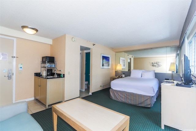 444 Kanekapolei St Unit 507, Honolulu, HI 96815 - tiled bedroom featuring a sink and a textured ceiling
