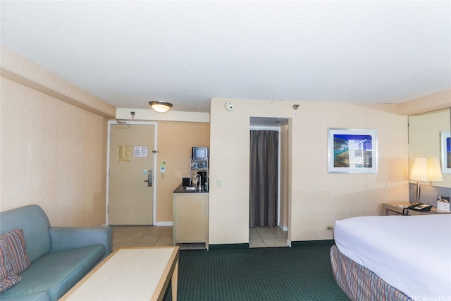 444 Kanekapolei St Unit 507, Honolulu, HI 96815 - bedroom with tile patterned flooring, a sink, and a textured ceiling