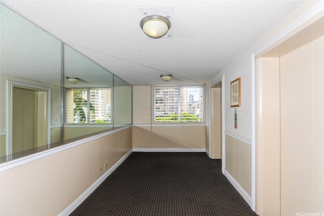 444 Kanekapolei St Unit 507, Honolulu, HI 96815 - corridor with a textured ceiling and baseboards