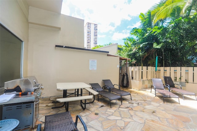 444 Kanekapolei St Unit 507, Honolulu, HI 96815 - view of patio / terrace with fence and a grill