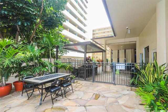 444 Kanekapolei St Unit 507, Honolulu, HI 96815 - view of patio with fence and outdoor dining space