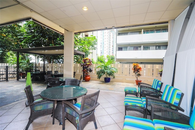 444 Kanekapolei St Unit 507, Honolulu, HI 96815 - view of patio with outdoor dining space and fence