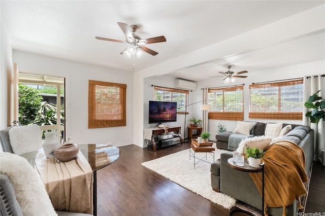 living area featuring an AC wall unit, ceiling fan, healthy amount of natural light, and dark wood-style floors