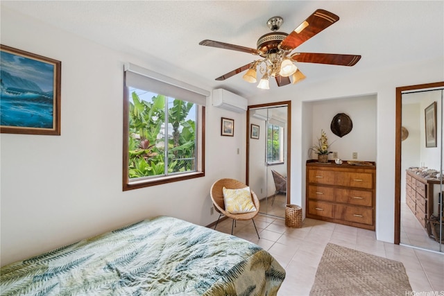 18 Dole Rd, Wahiawa, HI 96786 - bedroom featuring a wall mounted AC, light tile patterned flooring, two closets, and ceiling fan