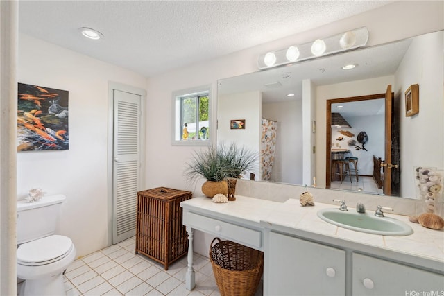 18 Dole Rd, Wahiawa, HI 96786 - bathroom featuring toilet, tile patterned flooring, vanity, and a textured ceiling