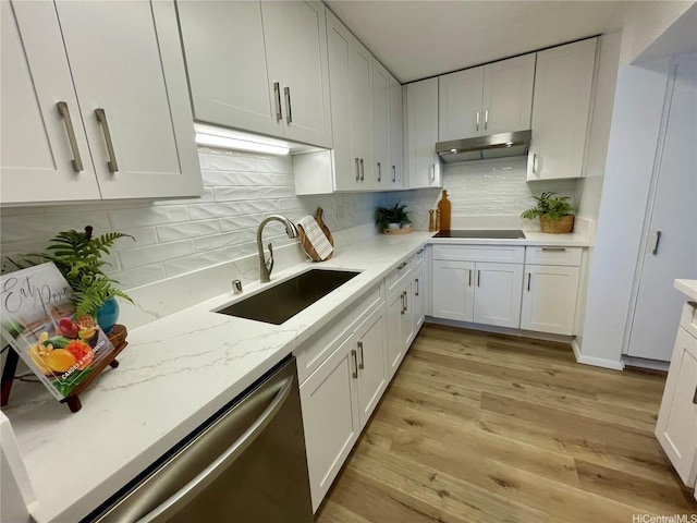 1561 Kanunu St Unit 1206, Honolulu, HI 96814 - kitchen with under cabinet range hood, a sink, stainless steel dishwasher, and white cabinetry
