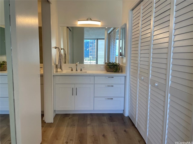 1561 Kanunu St Unit 1206, Honolulu, HI 96814 - bathroom with a closet, wood finished floors, and vanity