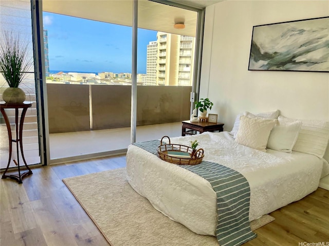 1561 Kanunu St Unit 1206, Honolulu, HI 96814 - bedroom featuring wood finished floors and a city view