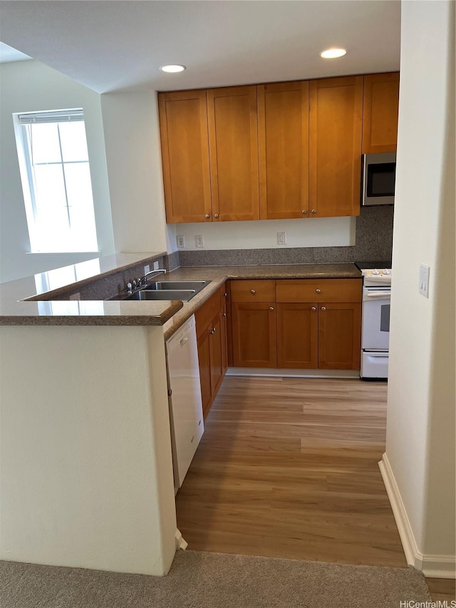 520 Lunalilo Home Rd Unit 7414, Honolulu, HI 96825 - kitchen with white appliances, a sink, brown cabinetry, recessed lighting, and a peninsula