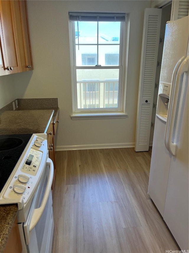 520 Lunalilo Home Rd Unit 7414, Honolulu, HI 96825 - kitchen with white appliances, plenty of natural light, and light wood finished floors