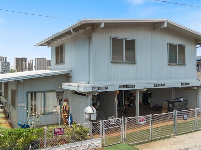 view of front of house featuring a gate and fence