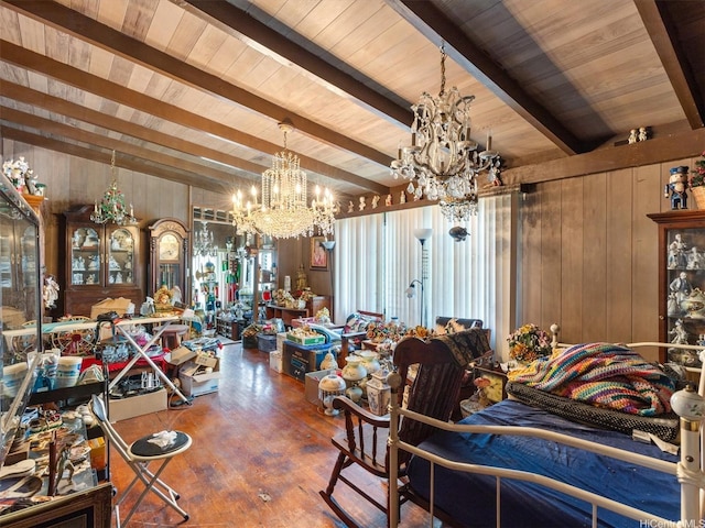 dining space featuring a chandelier, beamed ceiling, wood walls, wood finished floors, and wood ceiling