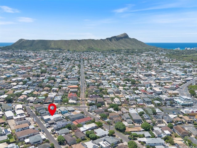aerial view of property and surrounding area with a water and mountain view