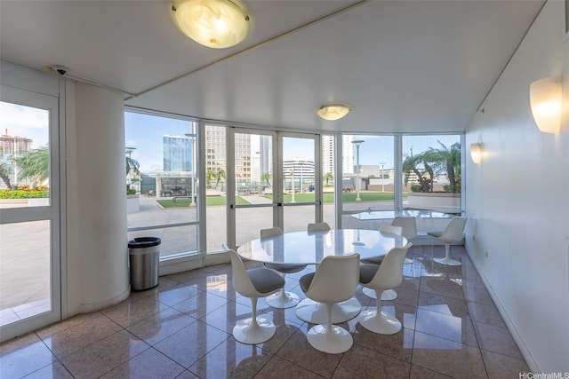 sunroom featuring a view of city