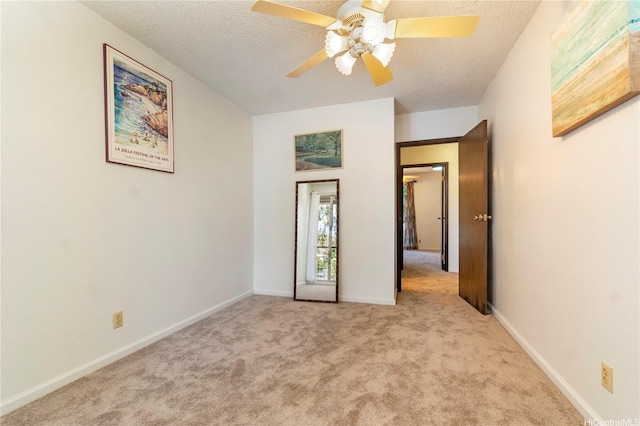 92-1044 Kanehoa Loop Unit 84, Kapolei, HI 96707 - unfurnished bedroom featuring carpet floors, a textured ceiling, a ceiling fan, and baseboards