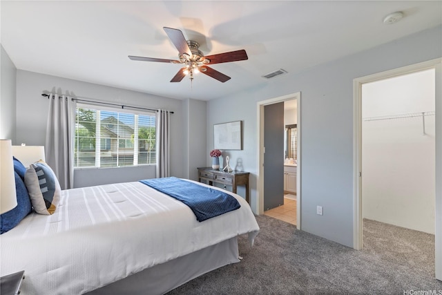 91-2125 Kaioli St Unit 3104, Ewa Beach, HI 96706 - bedroom featuring light carpet, ceiling fan, a walk in closet, ensuite bathroom, and a closet