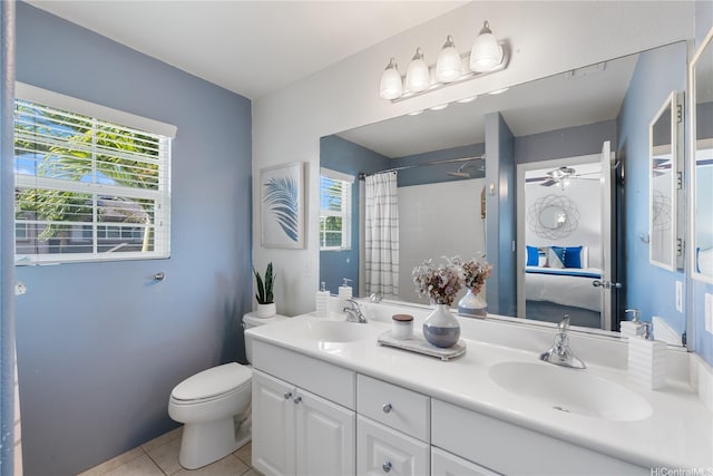 91-2125 Kaioli St Unit 3104, Ewa Beach, HI 96706 - ensuite bathroom with tile patterned flooring, double vanity, a shower with shower curtain, and ceiling fan
