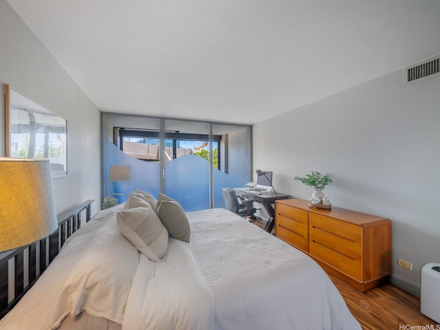 bedroom featuring wood finished floors