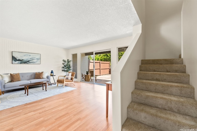 214 Koko Isle Cir Unit 1707, Honolulu, HI 96825 - stairway with wood finished floors and a textured ceiling