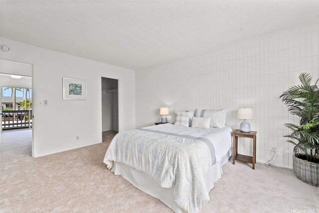 214 Koko Isle Cir Unit 1707, Honolulu, HI 96825 - bedroom with light carpet, a textured ceiling, and a closet