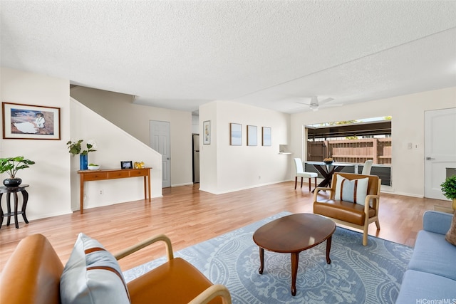 214 Koko Isle Cir Unit 1707, Honolulu, HI 96825 - living room with wood finished floors, a textured ceiling, and a ceiling fan