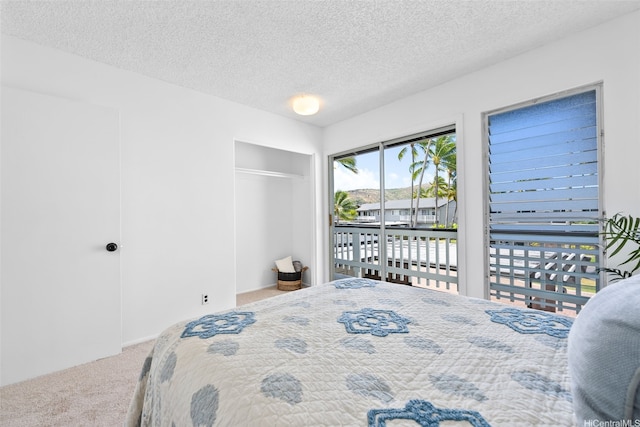 214 Koko Isle Cir Unit 1707, Honolulu, HI 96825 - carpeted bedroom featuring a textured ceiling