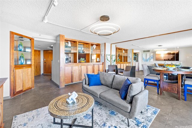 581 Kamoku St Unit 2408, Honolulu, HI 96826 - living room with a textured ceiling