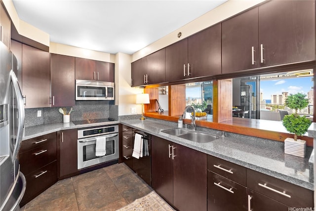 581 Kamoku St Unit 2408, Honolulu, HI 96826 - kitchen featuring stainless steel appliances, tasteful backsplash, dark stone finish flooring, and light stone countertops