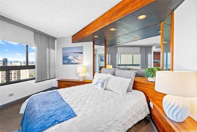 581 Kamoku St Unit 2408, Honolulu, HI 96826 - bedroom with recessed lighting, a city view, and a textured ceiling