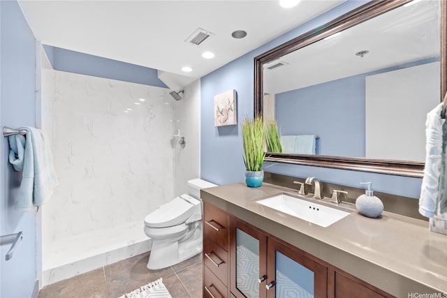 581 Kamoku St Unit 2408, Honolulu, HI 96826 - bathroom featuring vanity, a marble finish shower, tile patterned flooring, and recessed lighting