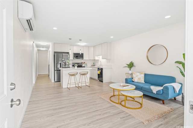 47-599 Alawiki St, Kaneohe, HI 96744 - living area featuring a wall mounted AC, baseboards, light wood-style flooring, and recessed lighting