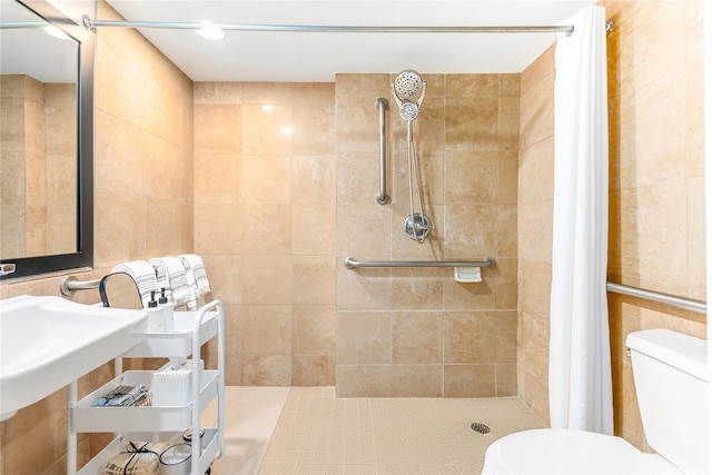 1850 Ala Moana Blvd Unit 202, Honolulu, HI 96815 - bathroom featuring toilet, a tile shower, and tile walls
