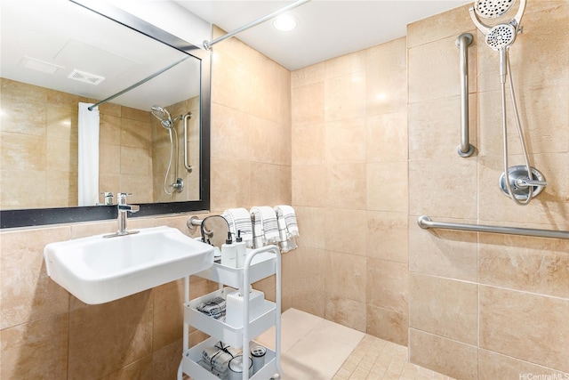 1850 Ala Moana Blvd Unit 202, Honolulu, HI 96815 - bathroom with a tile shower, a sink, and tile walls