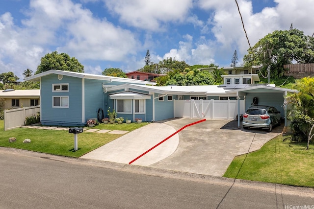 mid-century modern home with an attached carport and concrete driveway