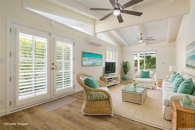 living room with a ceiling fan, wood finished floors, a wall mounted air conditioner, french doors, and baseboards