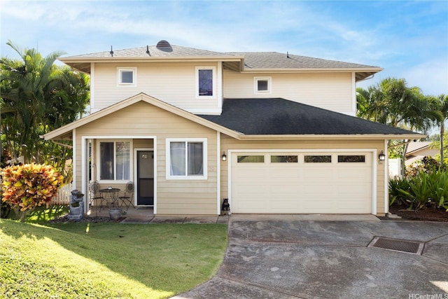 92-7049 Elele St Unit 29, Kapolei, HI 96707 - view of front facade featuring a front yard, driveway, a garage, and roof with shingles