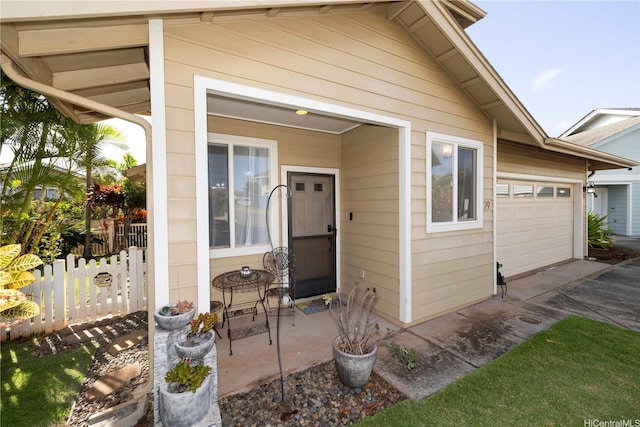 92-7049 Elele St Unit 29, Kapolei, HI 96707 - property entrance with driveway, fence, and an attached garage