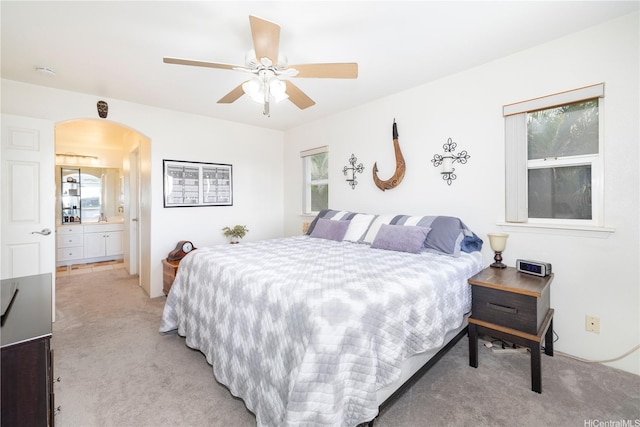 92-7049 Elele St Unit 29, Kapolei, HI 96707 - bedroom featuring light carpet, arched walkways, and ceiling fan
